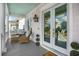 Front porch with wicker chairs and double French doors at 2312 Bucktail Ct, Mount Pleasant, SC 29466