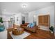 Spacious bonus room with leather couch and hardwood floors at 2312 Bucktail Ct, Mount Pleasant, SC 29466