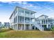 Two-story house with a light blue and white exterior, and a large backyard at 2312 Bucktail Ct, Mount Pleasant, SC 29466