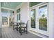 Spacious deck with gray flooring and white french doors leading to backyard at 2312 Bucktail Ct, Mount Pleasant, SC 29466