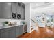 Gray wet bar with wine fridge and granite countertop at 2312 Bucktail Ct, Mount Pleasant, SC 29466