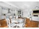 Open concept kitchen with white cabinets, island, and stainless steel appliances at 2312 Bucktail Ct, Mount Pleasant, SC 29466