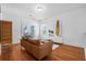 Bonus room with brown leather couch and access to balcony at 2312 Bucktail Ct, Mount Pleasant, SC 29466