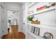 Hallway with built-in shelving and hardwood floors at 2312 Bucktail Ct, Mount Pleasant, SC 29466