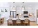 Bright kitchen with white cabinets, marble island, and stainless steel appliances at 483 Queenview Ln, Charleston, SC 29414