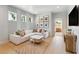 Spacious bonus room with white sectional sofa and large windows at 483 Queenview Ln, Charleston, SC 29414