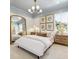 Cozy bedroom with a white bed frame, gold mirror, and soft color scheme at 483 Queenview Ln, Charleston, SC 29414