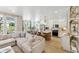Modern kitchen with white cabinets, quartz countertops and gold fixtures at 483 Queenview Ln, Charleston, SC 29414