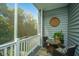 Relaxing screened porch with wooded views, ceiling fan and wicker furniture at 115 Claret Cup Way, Charleston, SC 29414