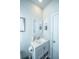 Clean bathroom with white vanity, mirror, and gray towels at 115 Claret Cup Way, Charleston, SC 29414