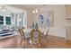 Charming dining area with round table and chairs near sunroom at 125 Grange Cir, Summerville, SC 29486