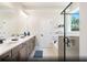 Elegant bathroom with double sinks, a soaking tub, and a walk-in shower at 266 Wappoo Trace Ln, Summerville, SC 29486