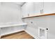 Laundry room with white cabinets, countertop, and built-in dog door at 2202 Norwood Oaks Dr, Mount Pleasant, SC 29466