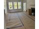 Spacious living room with large windows and hardwood floors at 369 Wappoo Trace Ln, Summerville, SC 29486