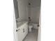 Modern bathroom with white vanity, black fixtures, and gray tile at 369 Wappoo Trace Ln, Summerville, SC 29486