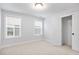 Bright bedroom with carpet, two windows, and a closet at 364 Wappoo Trace Ln, Summerville, SC 29486