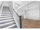 Modern staircase with white railings and dark wood steps at 364 Wappoo Trace Ln, Summerville, SC 29486