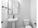 Small bathroom with pedestal sink and black fixtures at 364 Wappoo Trace Ln, Summerville, SC 29486