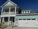 Two-story light teal home with white garage door at 364 Wappoo Trace Ln, Summerville, SC 29486