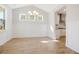 Spacious dining area with hardwood floors, chandelier, and built-in shelving at 707 Maynard Ln, Summerville, SC 29486