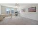 Bright home office features a large desk, carpeted floors, and two windows at 487 Pender Woods Dr, Summerville, SC 29486