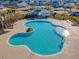 Aerial view of community pool with surrounding landscaping and cabana at 487 Pender Woods Dr, Summerville, SC 29486