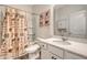 Main bathroom with shower/tub, white vanity, and wood-look floor at 487 Pender Woods Dr, Summerville, SC 29486