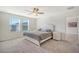 Main bedroom with a queen bed, dresser, and access to another room at 487 Pender Woods Dr, Summerville, SC 29486