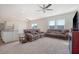 Spacious living room with two reclining sofas and a ceiling fan at 487 Pender Woods Dr, Summerville, SC 29486
