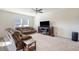 Bright living room features a comfortable sofa and large TV at 487 Pender Woods Dr, Summerville, SC 29486
