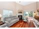 Relaxing living room with hardwood floors, fireplace, and sliding glass doors to patio at 2821 Pottinger Dr, Johns Island, SC 29455