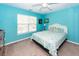 Bedroom with teal walls, white wicker bed frame, and a window at 2821 Pottinger Dr, Johns Island, SC 29455