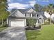 Two-story house with a landscaped lawn and attached garage at 2180 Tall Grass Cir, Mount Pleasant, SC 29466