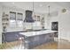 Bright kitchen features a large island, white quartz countertops, and dark cabinetry at 3546 Saltflat Ln, Mount Pleasant, SC 29466