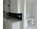 Modern kitchen featuring white cabinetry and a built-in desk at 357 Wappoo Trace Ln, Summerville, SC 29486