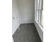 Laundry room with dark hexagon tile flooring and built-in shelving at 357 Wappoo Trace Ln, Summerville, SC 29486
