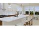 Open concept kitchen with marble countertops and a kitchen island at 5209 Seewee Rd, Awendaw, SC 29429