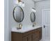 Elegant bathroom with double vanity, marble countertop, and gold fixtures at 5209 Seewee Rd, Awendaw, SC 29429