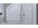 Modern bathroom with white herringbone tile shower, soaking tub, and white vanity at 5209 Seewee Rd, Awendaw, SC 29429