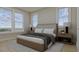 Spacious bedroom with large windows offering scenic views and a neutral color palette at 5209 Seewee Rd, Awendaw, SC 29429