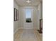 Bright entryway with hardwood floors, area rug, and view at 5209 Seewee Rd, Awendaw, SC 29429
