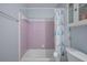 Small bathroom with purple tile, shower/tub combo, and a white toilet at 2503 S Hwy 17A, Summerville, SC 29483