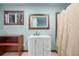 Clean bathroom with white vanity, a large mirror, and a neutral color scheme at 2503 S Hwy 17A, Summerville, SC 29483