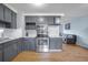 Updated kitchen featuring stainless steel appliances and gray cabinets at 2503 S Hwy 17A, Summerville, SC 29483