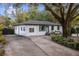 White brick ranch house with driveway and landscaping at 2503 S Hwy 17A, Summerville, SC 29483