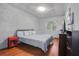 Spacious bedroom with wood floors and a brick feature wall at 2503 S Hwy 17A, Summerville, SC 29483