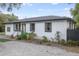 Charming white brick ranch house with black trim at 2503 S Hwy 17A, Summerville, SC 29483