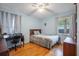 Cozy bedroom with hardwood floors and a desk at 2503 S Hwy 17A, Summerville, SC 29483