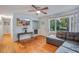 Bright living room with hardwood floors, bay window, and a comfy sectional sofa at 2503 S Hwy 17A, Summerville, SC 29483