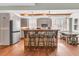 Modern kitchen with island seating, stainless steel appliances, and hardwood floors at 318 Simmons Ave, Summerville, SC 29483